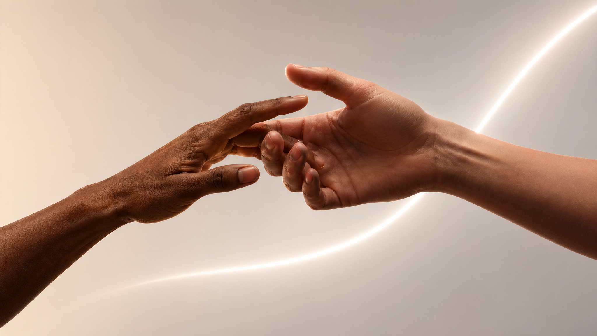 Two hands reaching toward each other